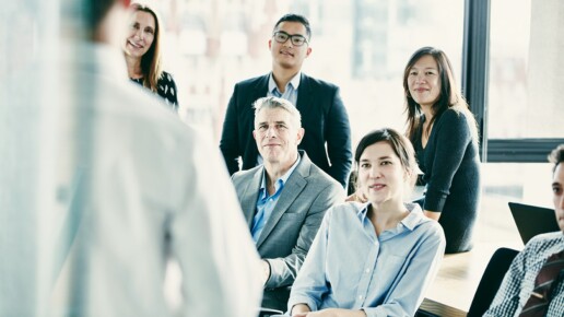 Leadership team discussing communication about AI initiatives and organizational change